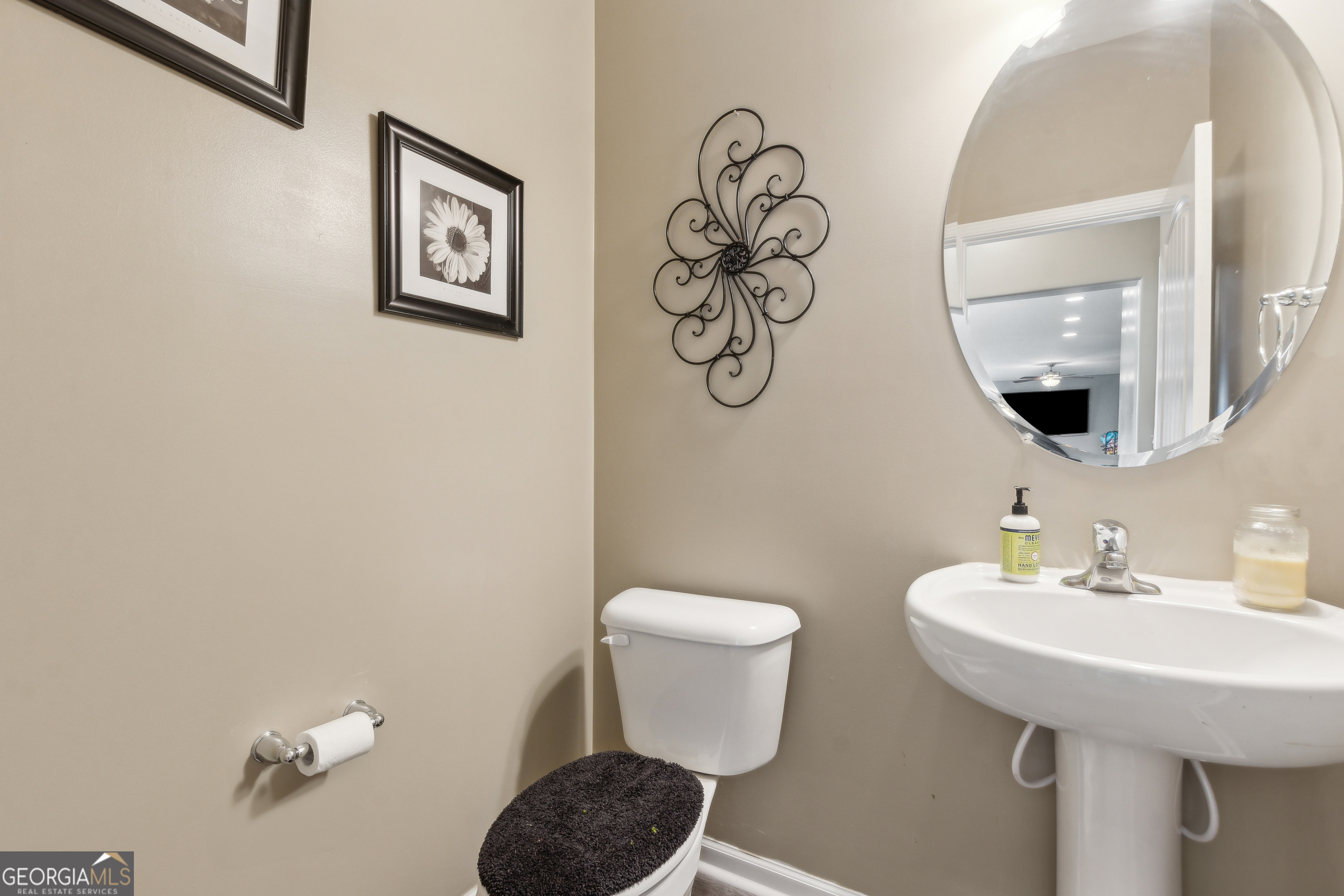 103 Olson Way Kingsland, GA 31548 - Photo 30 of 54 a bathroom with a toilet sink and mirror