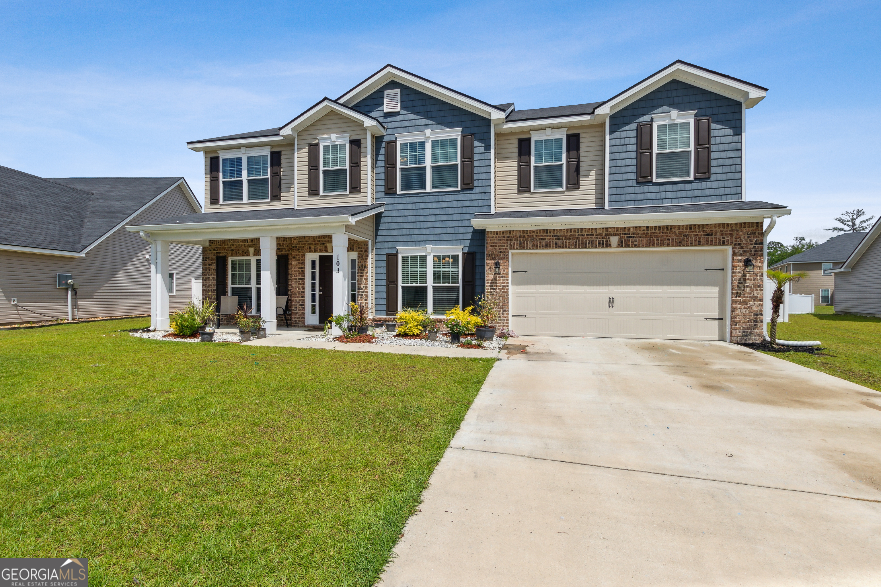 103 Olson Way Kingsland, GA 31548 - Photo 3 of 54 a front view of house with yard and green space
