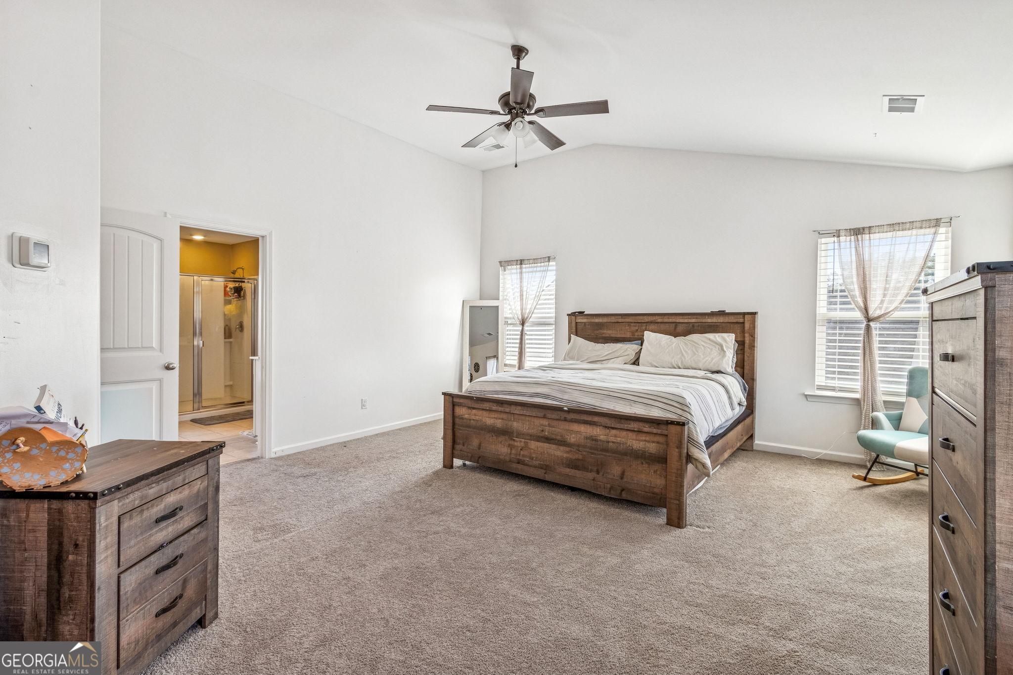 103 Olson Way Kingsland, GA 31548 - Photo 32 of 54 a bedroom with a bed and a chandelier