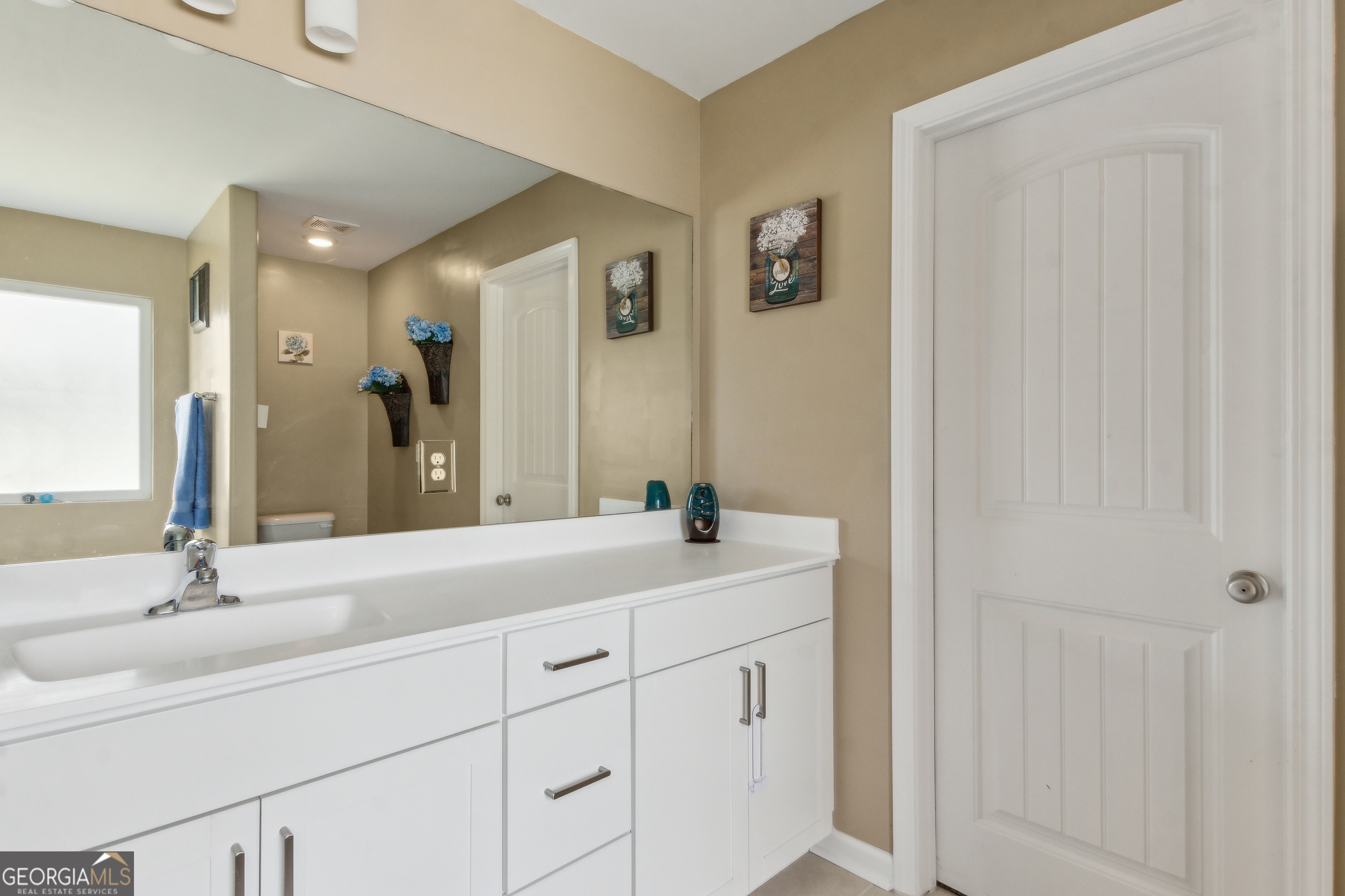 103 Olson Way Kingsland, GA 31548 - Photo 34 of 54 a bathroom with a double vanity sink and a mirror