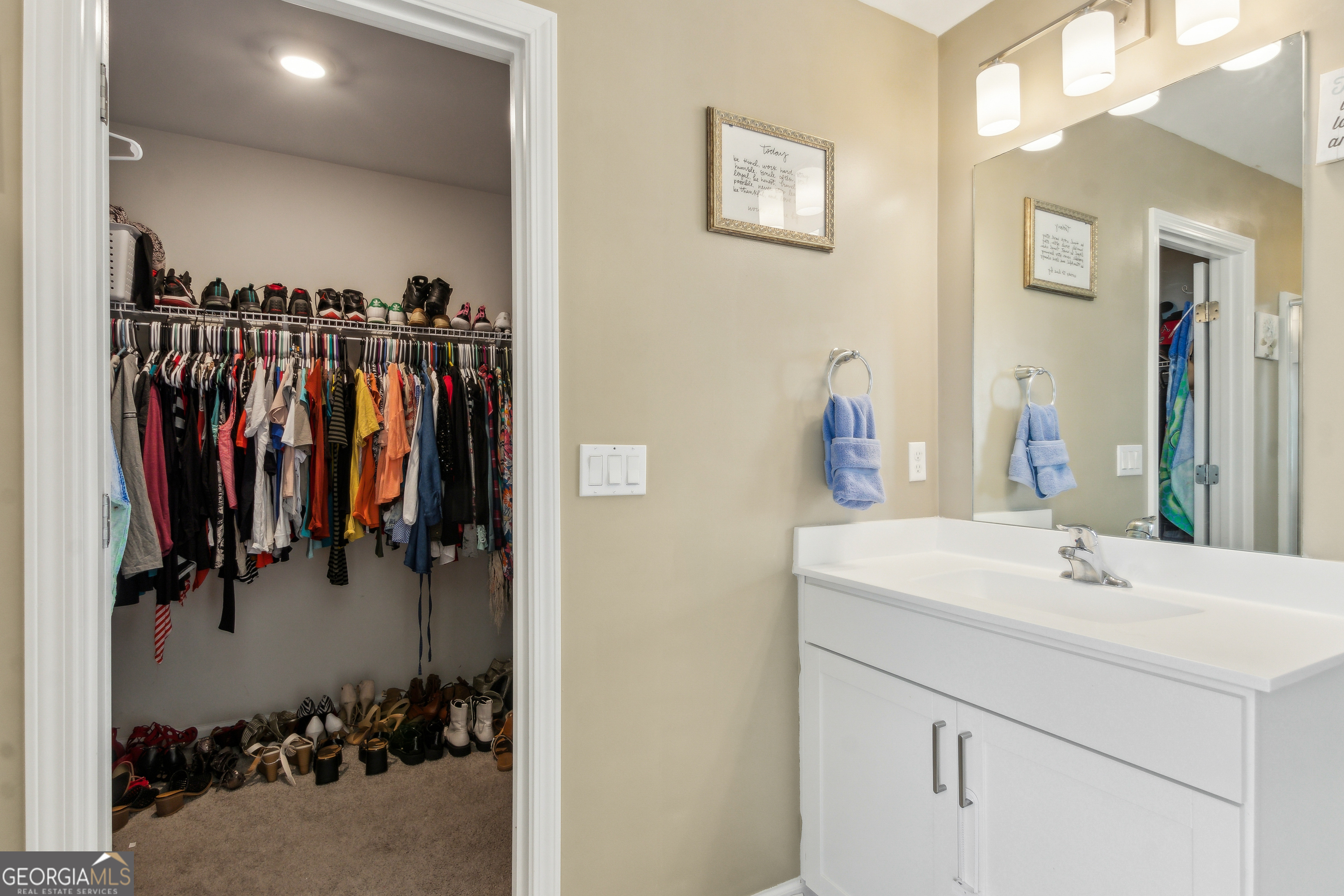 103 Olson Way Kingsland, GA 31548 - Photo 35 of 54 a bathroom with a sink vanity and a mirror