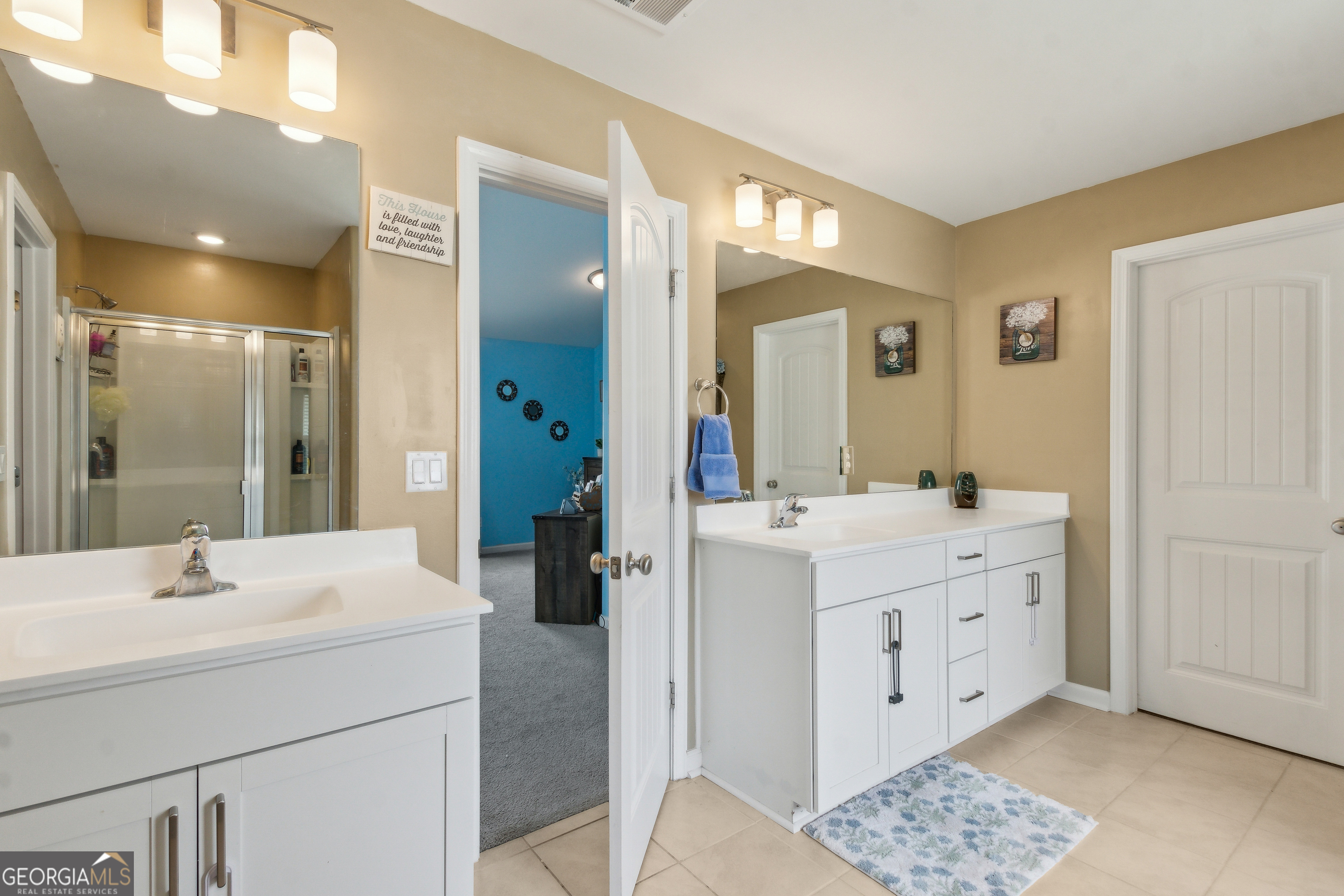 103 Olson Way Kingsland, GA 31548 - Photo 36 of 54 a bathroom with a sink a mirror and a shower