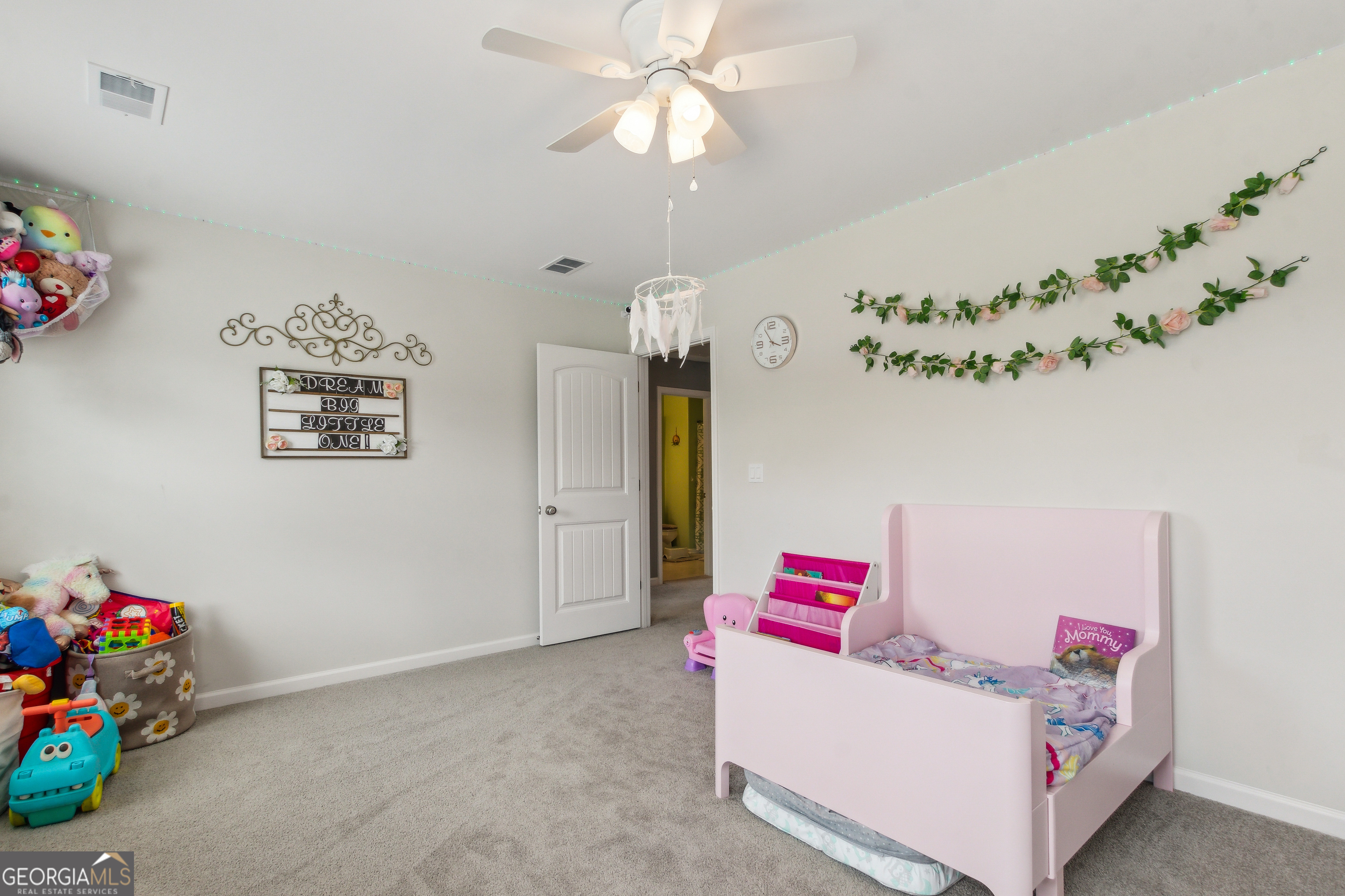 103 Olson Way Kingsland, GA 31548 - Photo 40 of 54 a bedroom with furniture and a chandelier