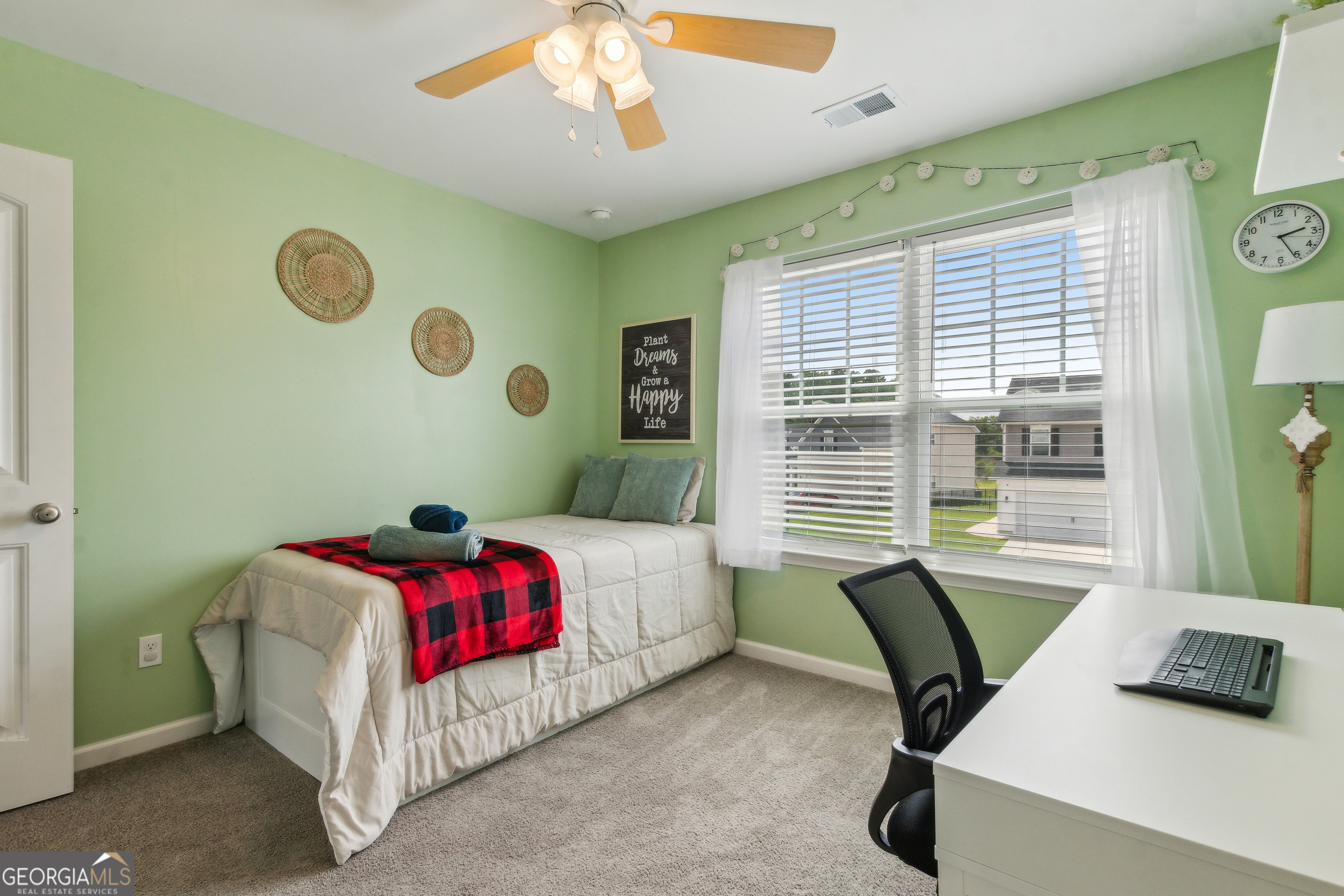 103 Olson Way Kingsland, GA 31548 - Photo 42 of 54 a bedroom with a bed and a large window