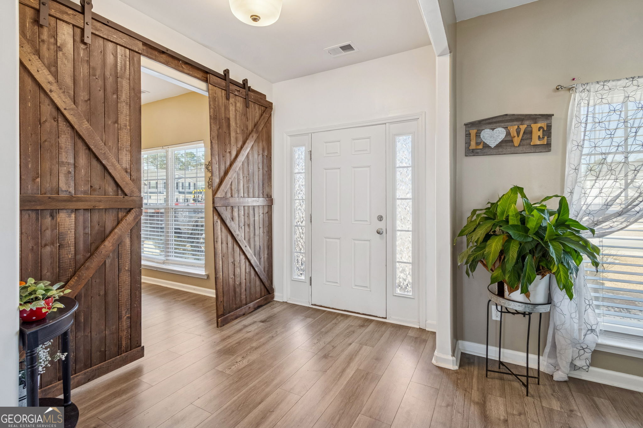 103 Olson Way Kingsland, GA 31548 - Photo 5 of 54 a view of entryway with wooden floor and stairs
