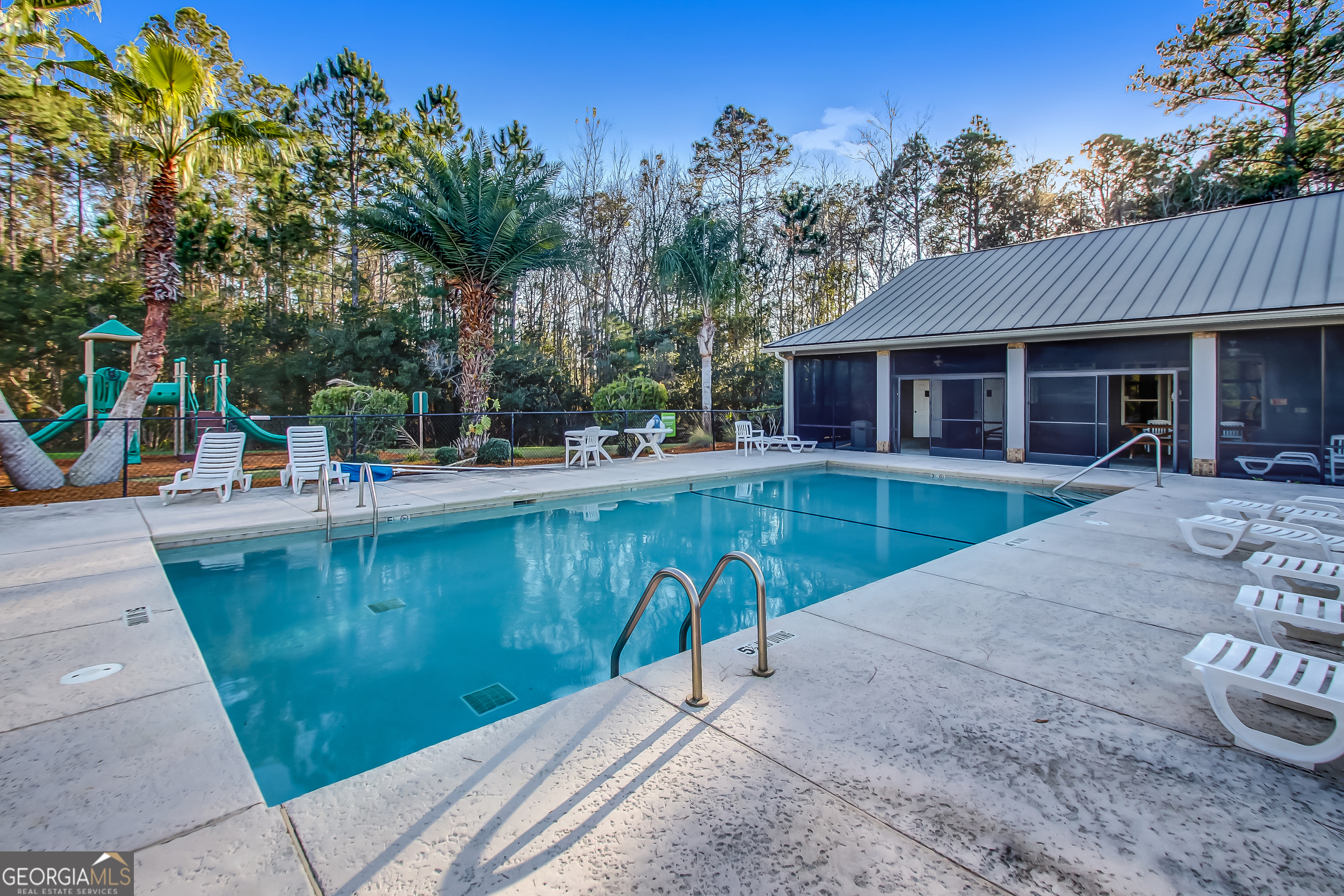 103 Olson Way Kingsland, GA 31548 - Photo 53 of 54 swimming pool with outdoor seating and yard