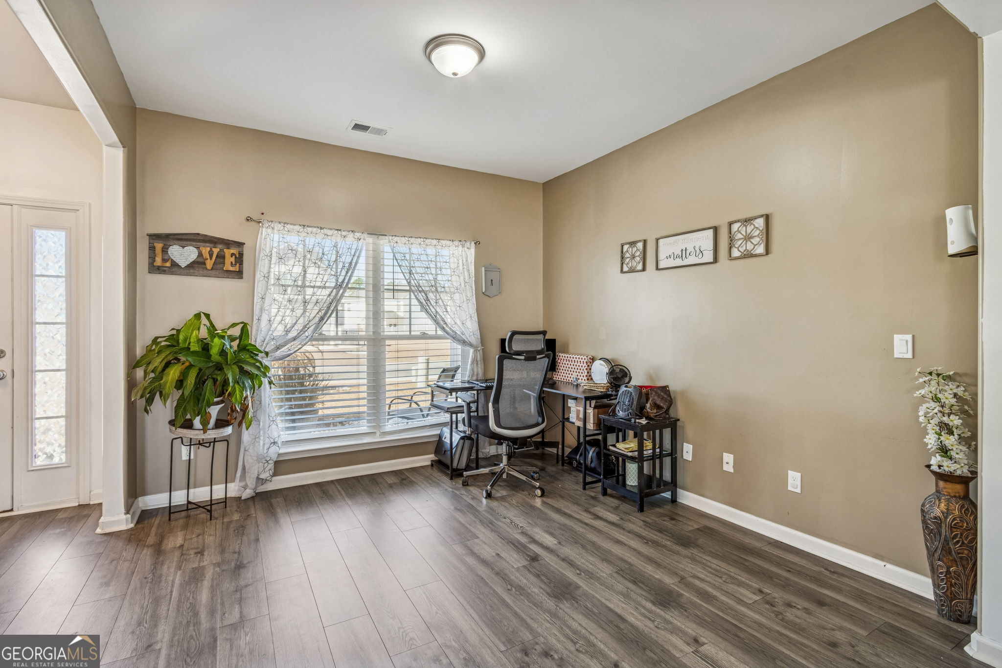 103 Olson Way Kingsland, GA 31548 - Photo 9 of 54 a view of a room with wooden floor and windows