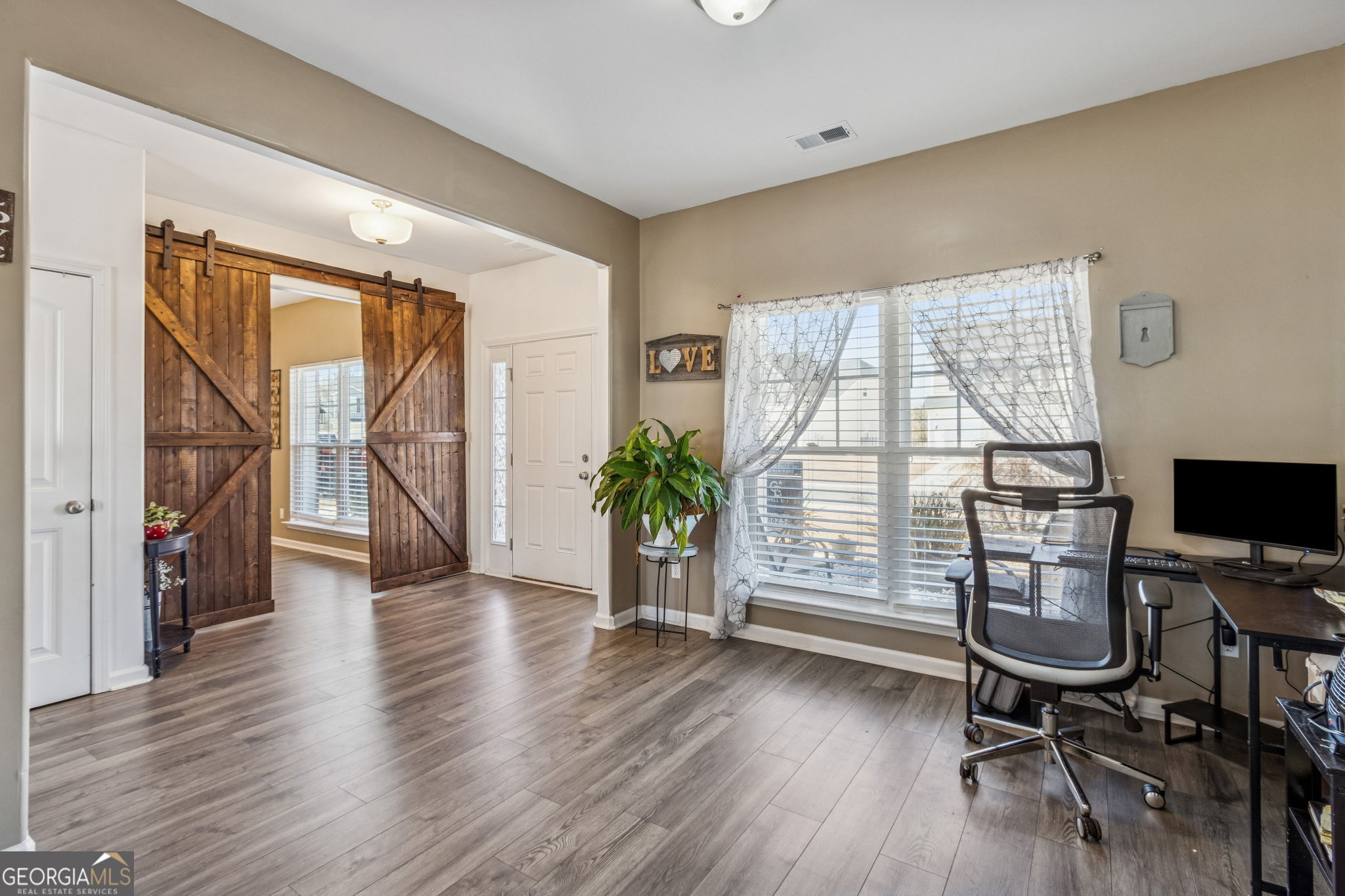 103 Olson Way Kingsland, GA 31548 - Photo 10 of 54 a view of a workspace with wooden floor and a window