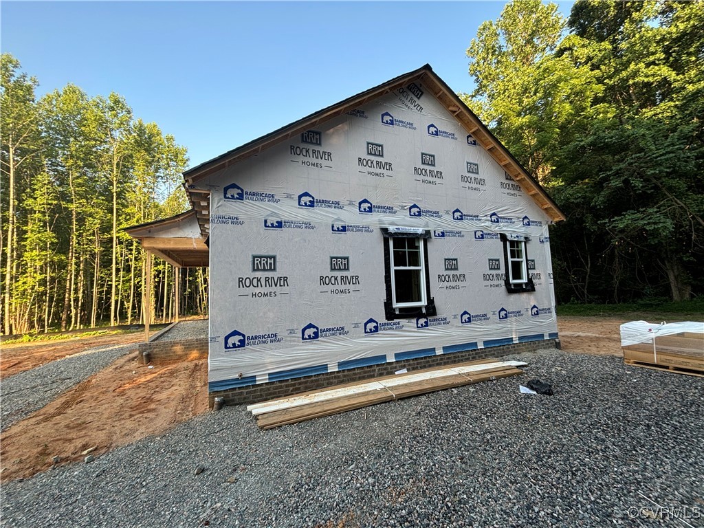 80 Maple Tree Lane Spring Grove, VA 23881 - Photo 3 of 14 a front view of a house with a yard