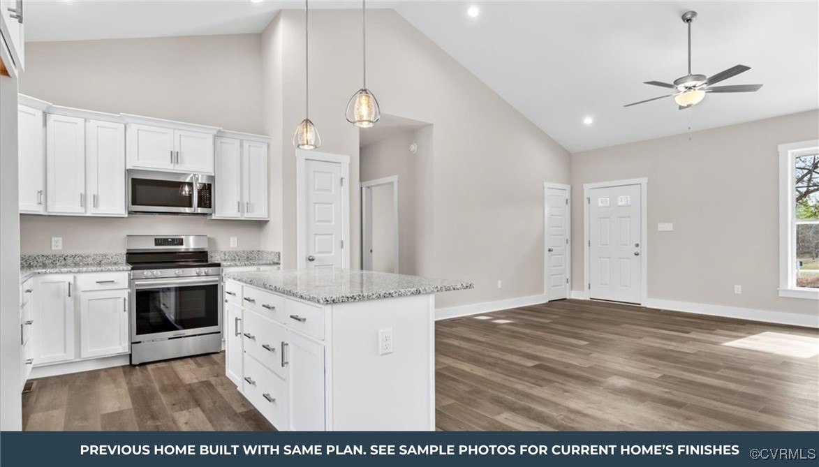 80 Maple Tree Lane Spring Grove, VA 23881 - Photo 8 of 14 a kitchen with stainless steel appliances granite countertop a stove a sink and a refrigerator