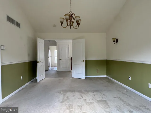a bathroom with a tub sink shower and mirror