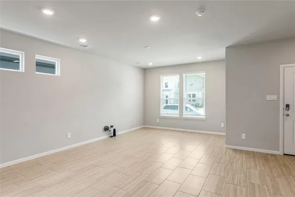 a view of an empty room with a window