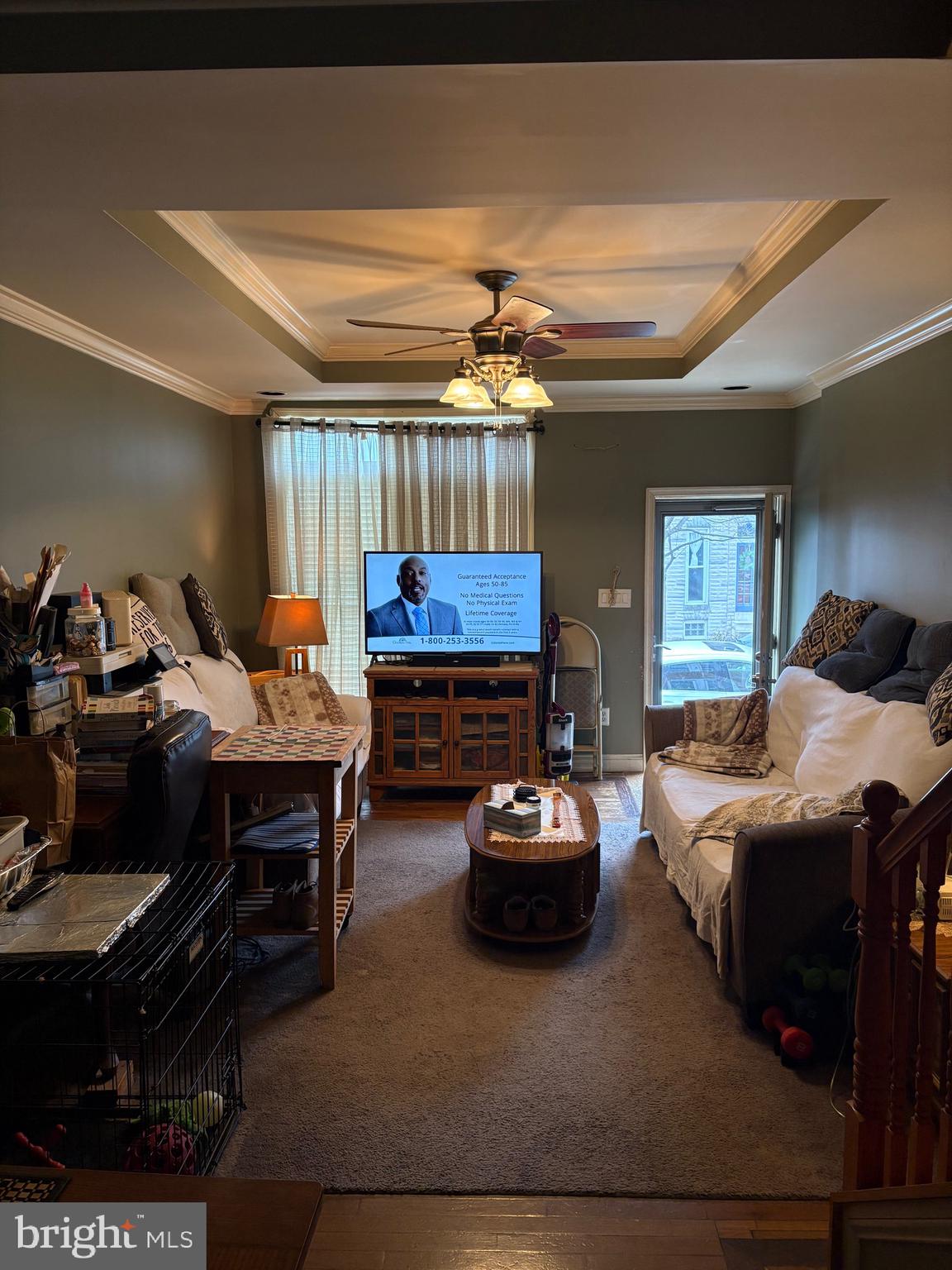 2713 Hampden Avenue Baltimore, MD 21211 - Photo 3 of 23 a living room with furniture a rug and a chandelier