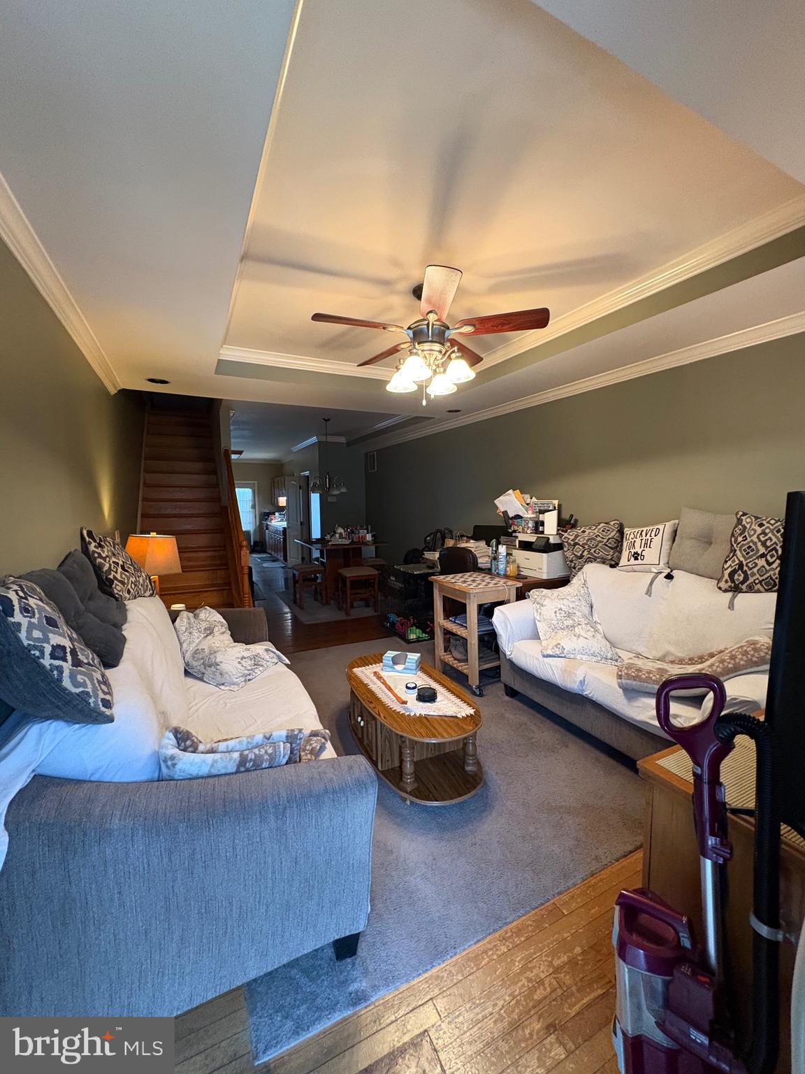 2713 Hampden Avenue Baltimore, MD 21211 - Photo 5 of 23 a living room with furniture and a chandelier