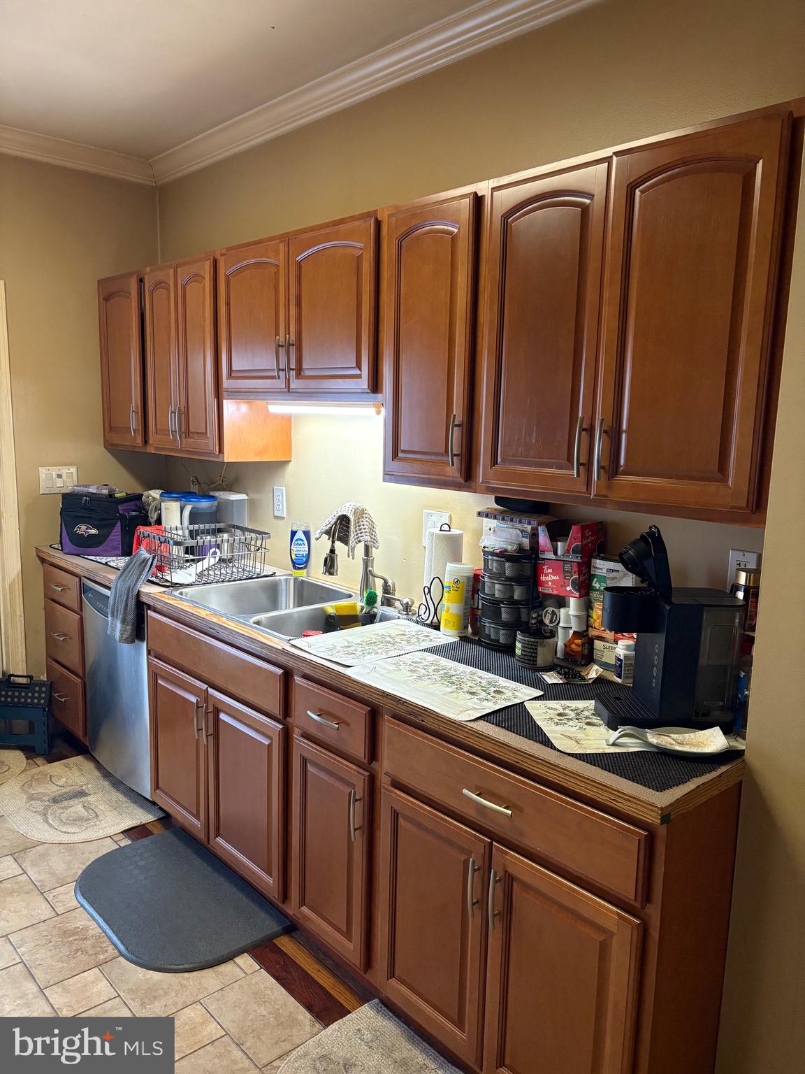 2713 Hampden Avenue Baltimore, MD 21211 - Photo 10 of 23 a kitchen with granite countertop a sink a stove and cabinets