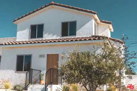 a house view with a wooden fencing