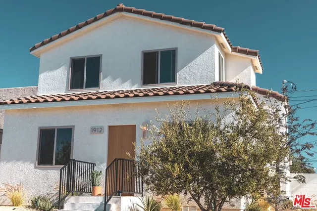 a house view with a wooden fencing