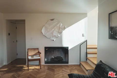 a bedroom with furniture and a fireplace