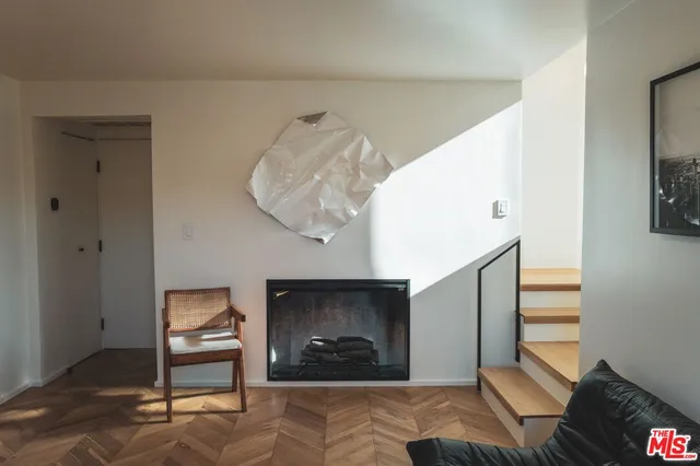 a bedroom with furniture and a fireplace
