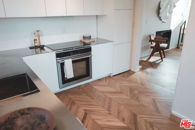 a kitchen with a stove and a microwave