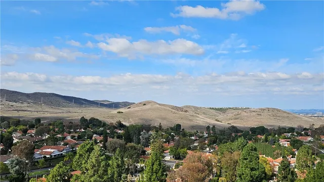 a view of a town with mountains in the background