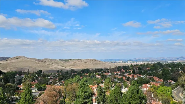 a view of a mountain range in a cloudy sky