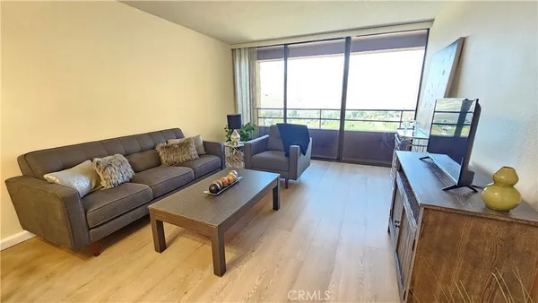 a living room with furniture and a large window