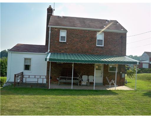 Exterior Back. This home has a covered patio in the rear as well as a covered front porch.