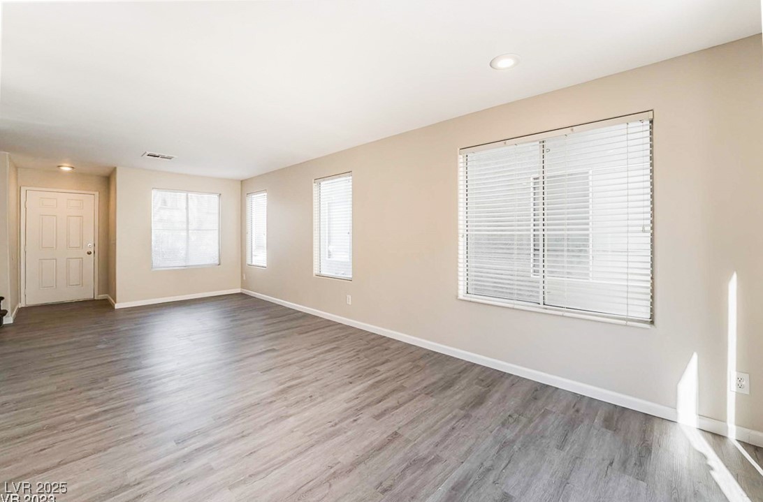2082 Pillar Pointe Street Las Vegas, NV 89115 - Photo 14 of 18 Spare room featuring wood finished floors and recessed lighting