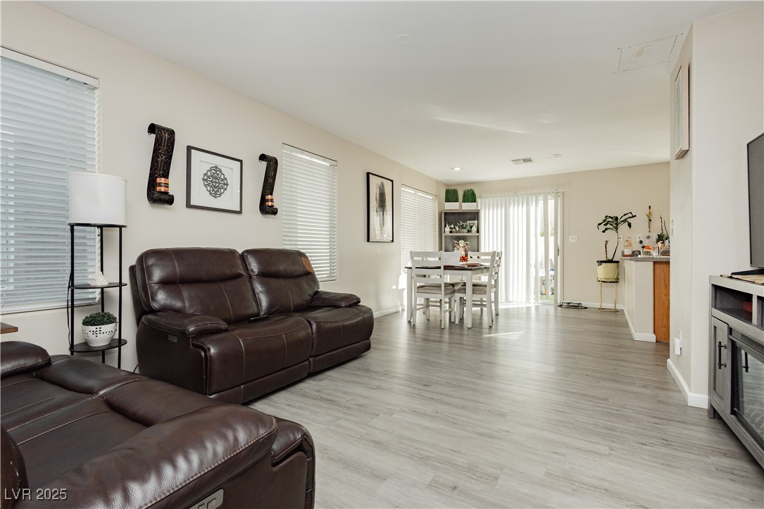 2082 Pillar Pointe Street Las Vegas, NV 89115 - Photo 7 of 18 Living area featuring light wood-style flooring and baseboards