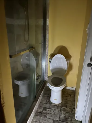 a bathroom with a toilet and a sink