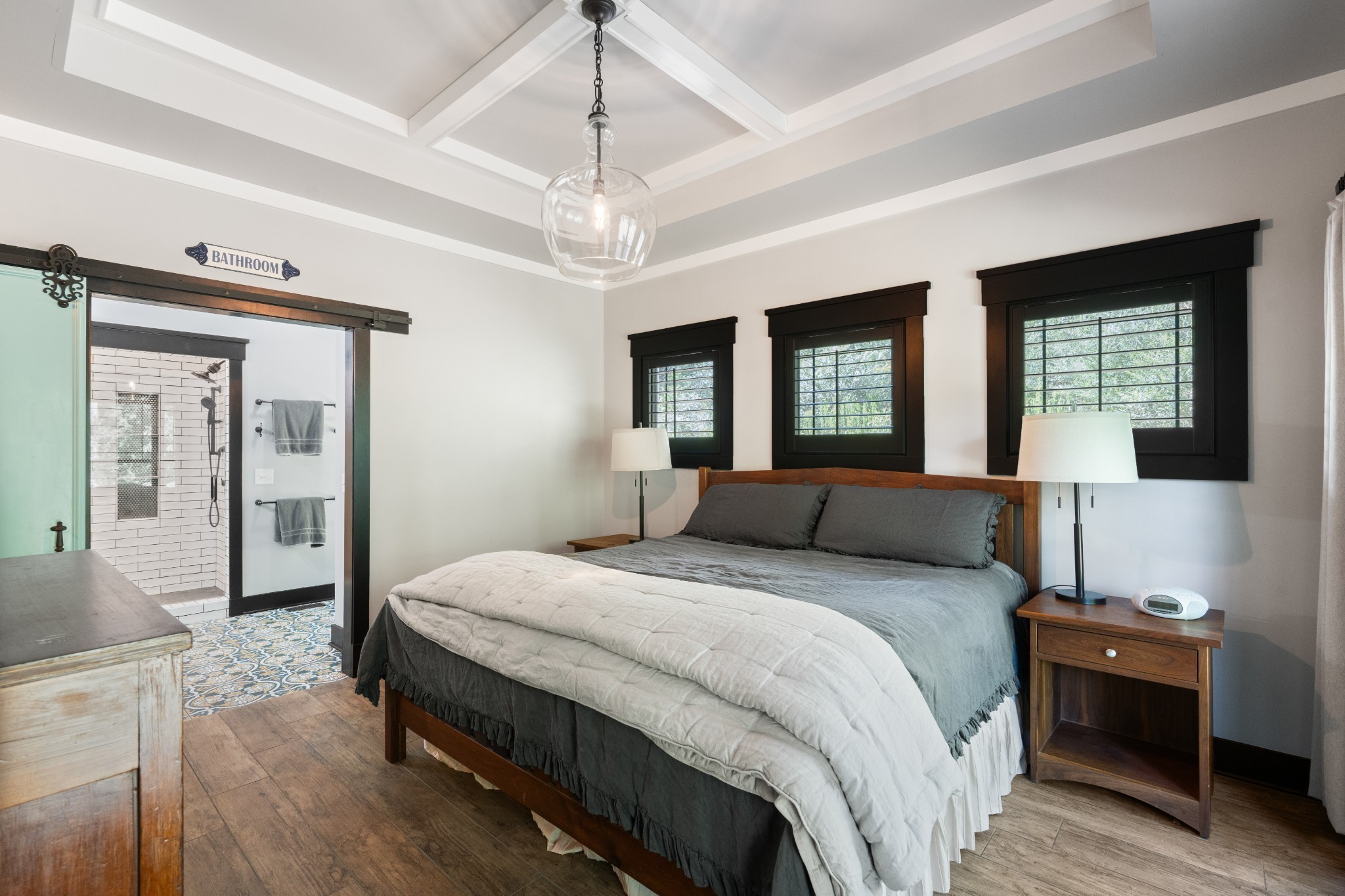 170 Rodeo Drive Columbia, TN 38401 - Photo 20 of 60 a spacious bedroom with a large bed and a chandelier