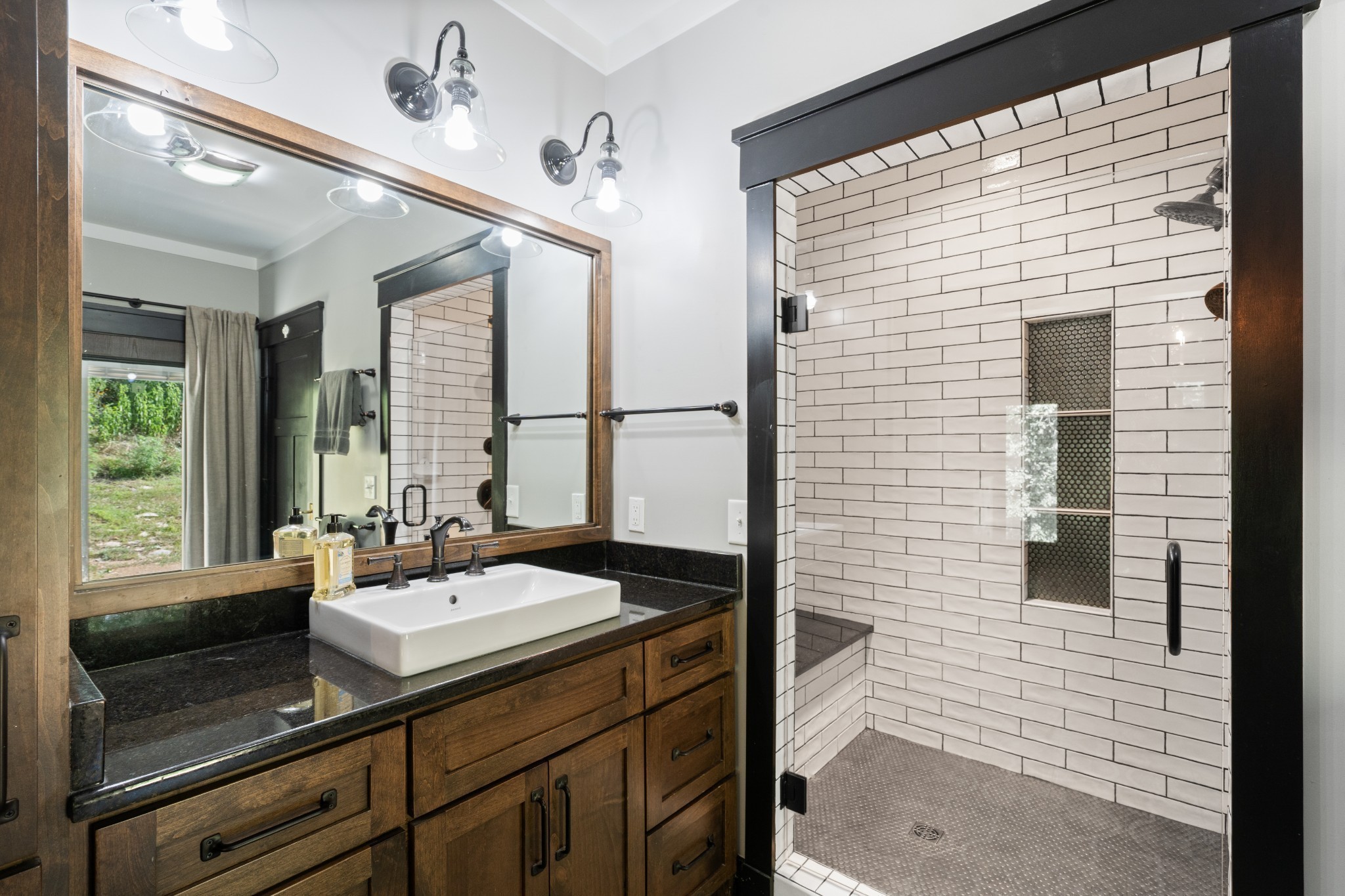 170 Rodeo Drive Columbia, TN 38401 - Photo 22 of 60 a bathroom with a sink a mirror and a shower