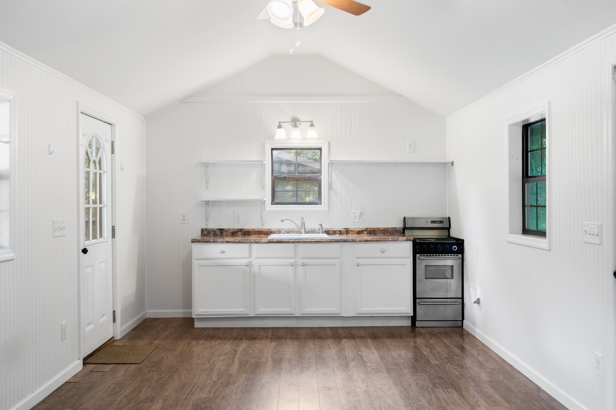 170 Rodeo Drive Columbia, TN 38401 - Photo 39 of 60 a kitchen with stainless steel appliances a sink a stove a refrigerator and cabinets