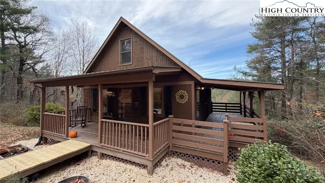 a view of a house with a small deck