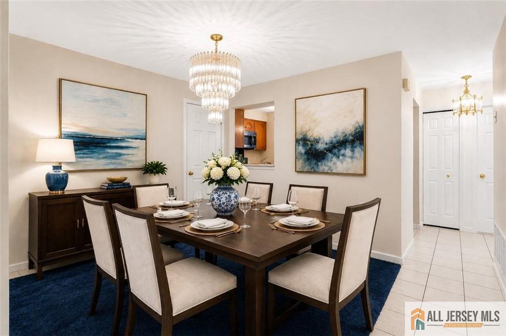 40C Rutland Lane, Unit 40B Monroe Township, NJ 08831 - Photo 6 of 37 a view of a dining room with furniture and wooden floor
