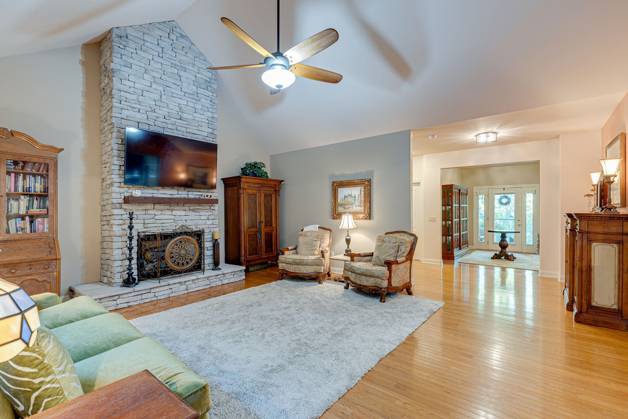 1457 Center Star Road Columbia, TN 38401 - Photo 14 of 45 a living room with furniture a flat screen tv and a fireplace