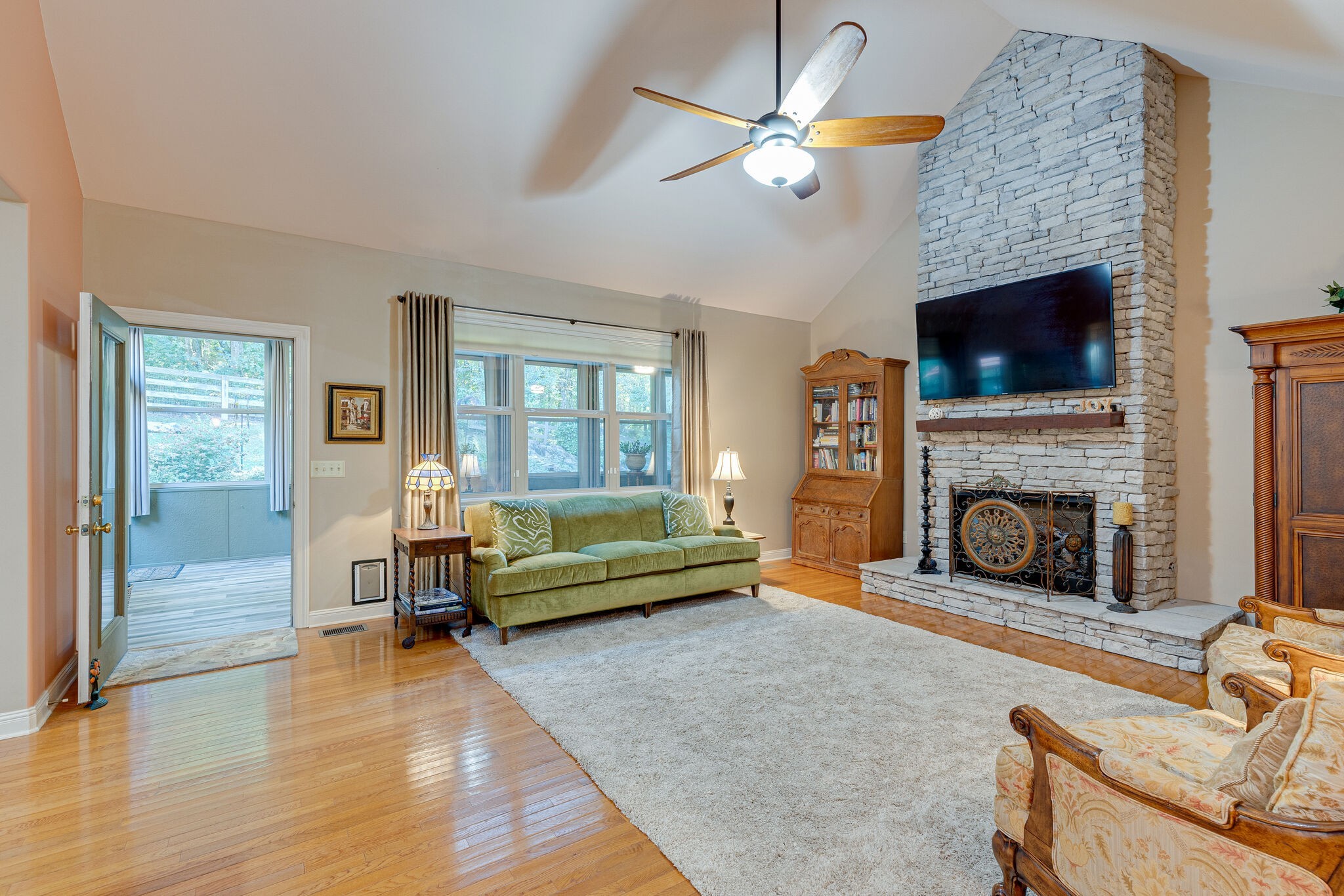1457 Center Star Road Columbia, TN 38401 - Photo 16 of 45 a living room with furniture a flat screen tv and a fireplace