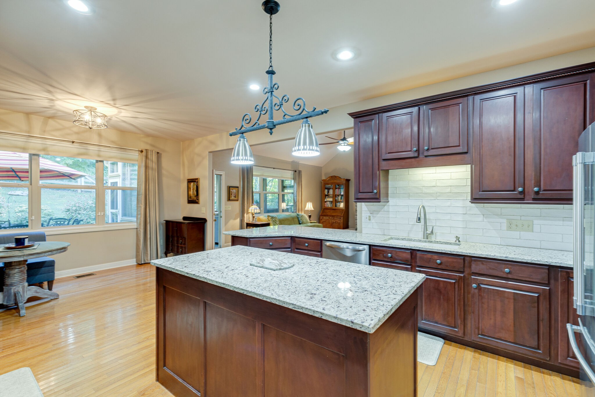 1457 Center Star Road Columbia, TN 38401 - Photo 19 of 45 a kitchen with stainless steel appliances granite countertop wooden cabinets a sink dishwasher and a stove with wooden floor