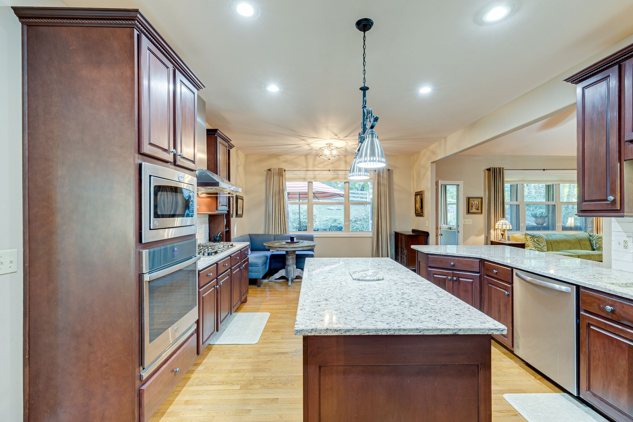 1457 Center Star Road Columbia, TN 38401 - Photo 20 of 45 a large kitchen with kitchen island granite countertop a large counter top stainless steel appliances and cabinets