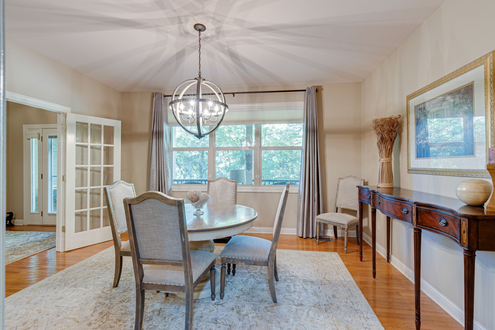 1457 Center Star Road Columbia, TN 38401 - Photo 24 of 45 a dining room with furniture a chandelier and wooden floor