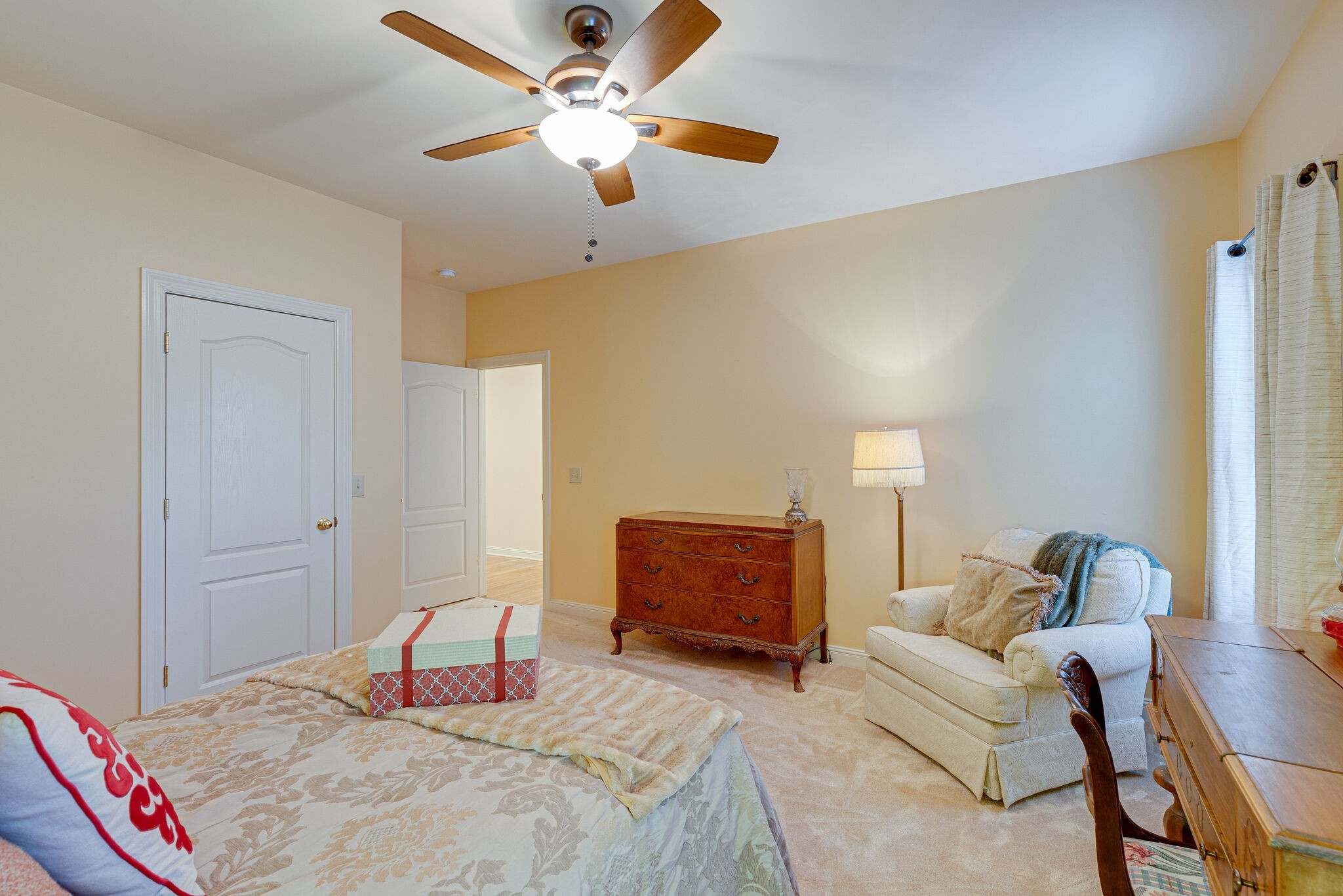 1457 Center Star Road Columbia, TN 38401 - Photo 36 of 45 a bedroom with a bed couch and a ceiling fan