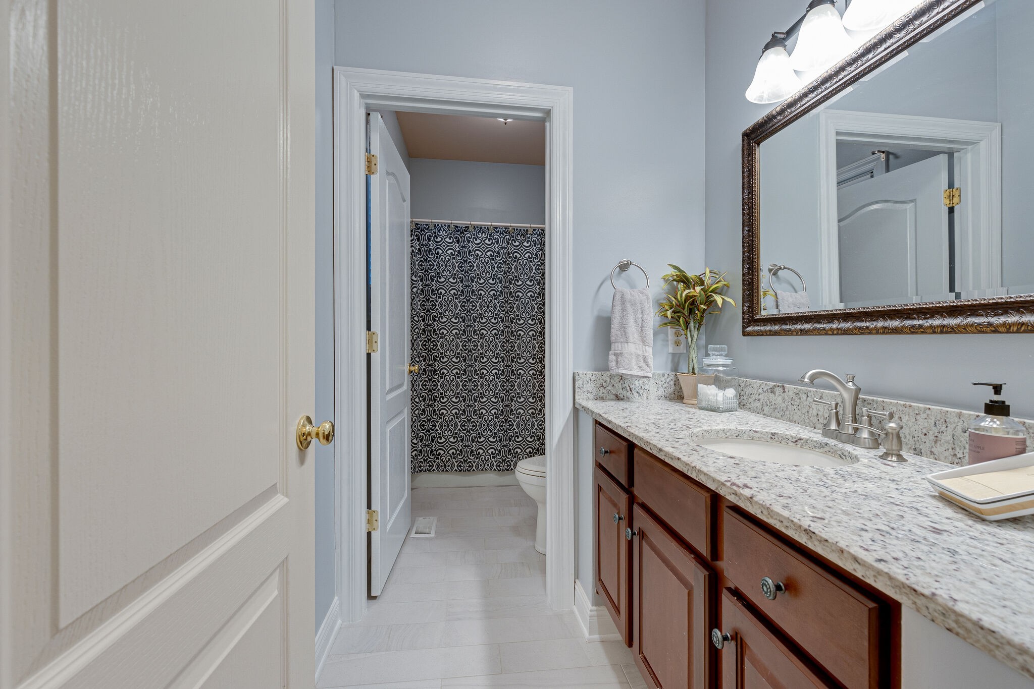 1457 Center Star Road Columbia, TN 38401 - Photo 37 of 45 a bathroom with a granite countertop sink and a mirror