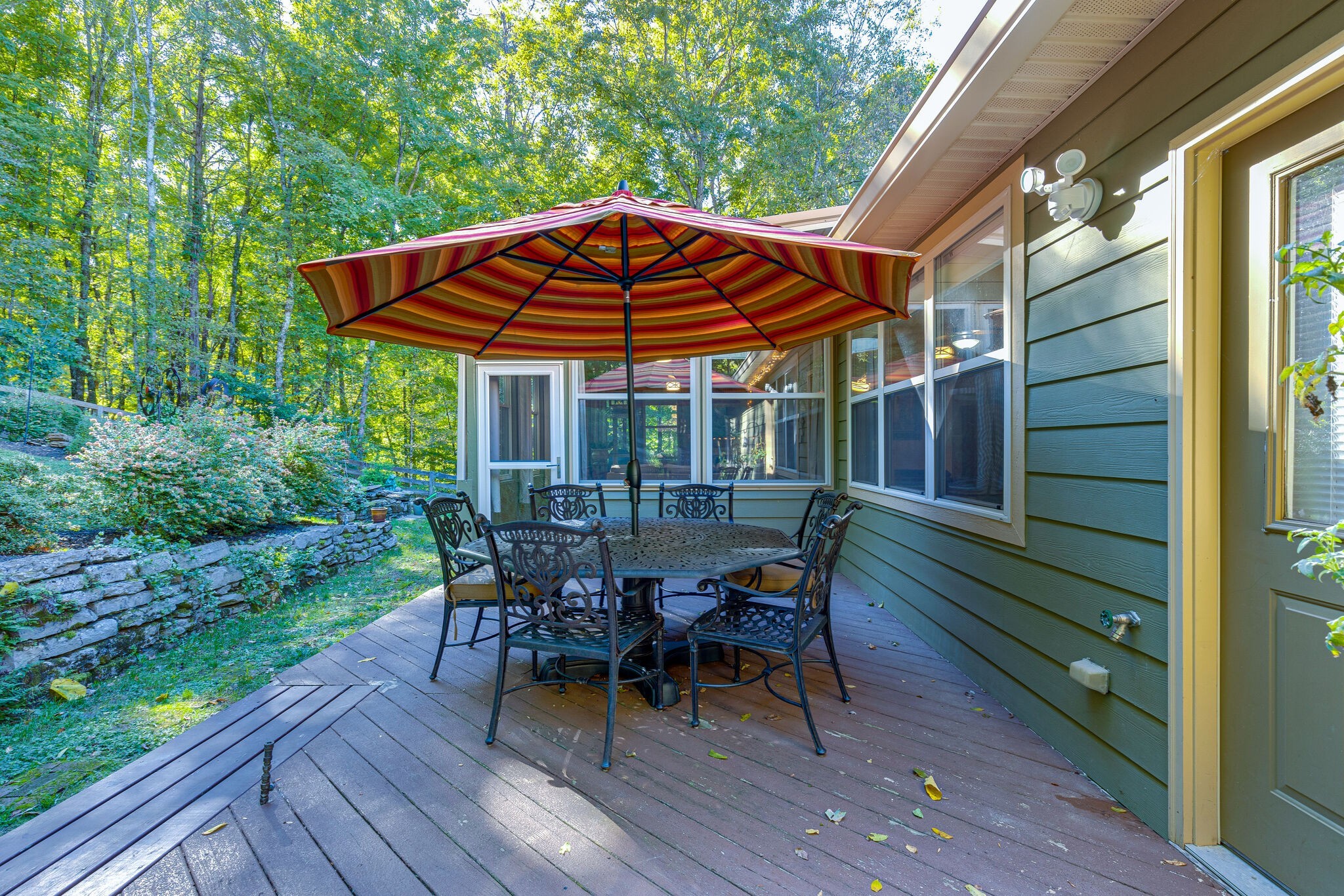 1457 Center Star Road Columbia, TN 38401 - Photo 43 of 45 a patio with wooden floor a yard a table and chairs