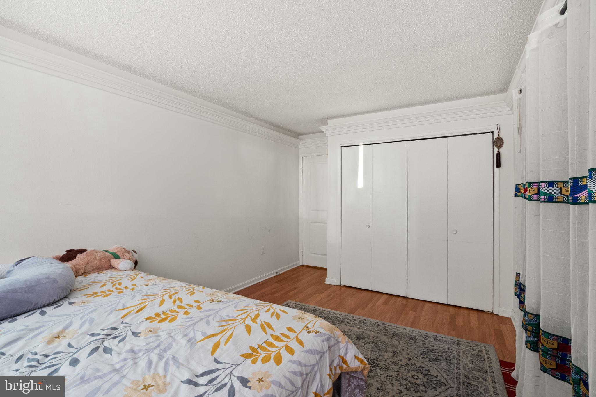 1832 Metzerott Road, Unit 303 Adelphi, MD 20783 - Photo 16 of 22 a bedroom with a bed and a closet