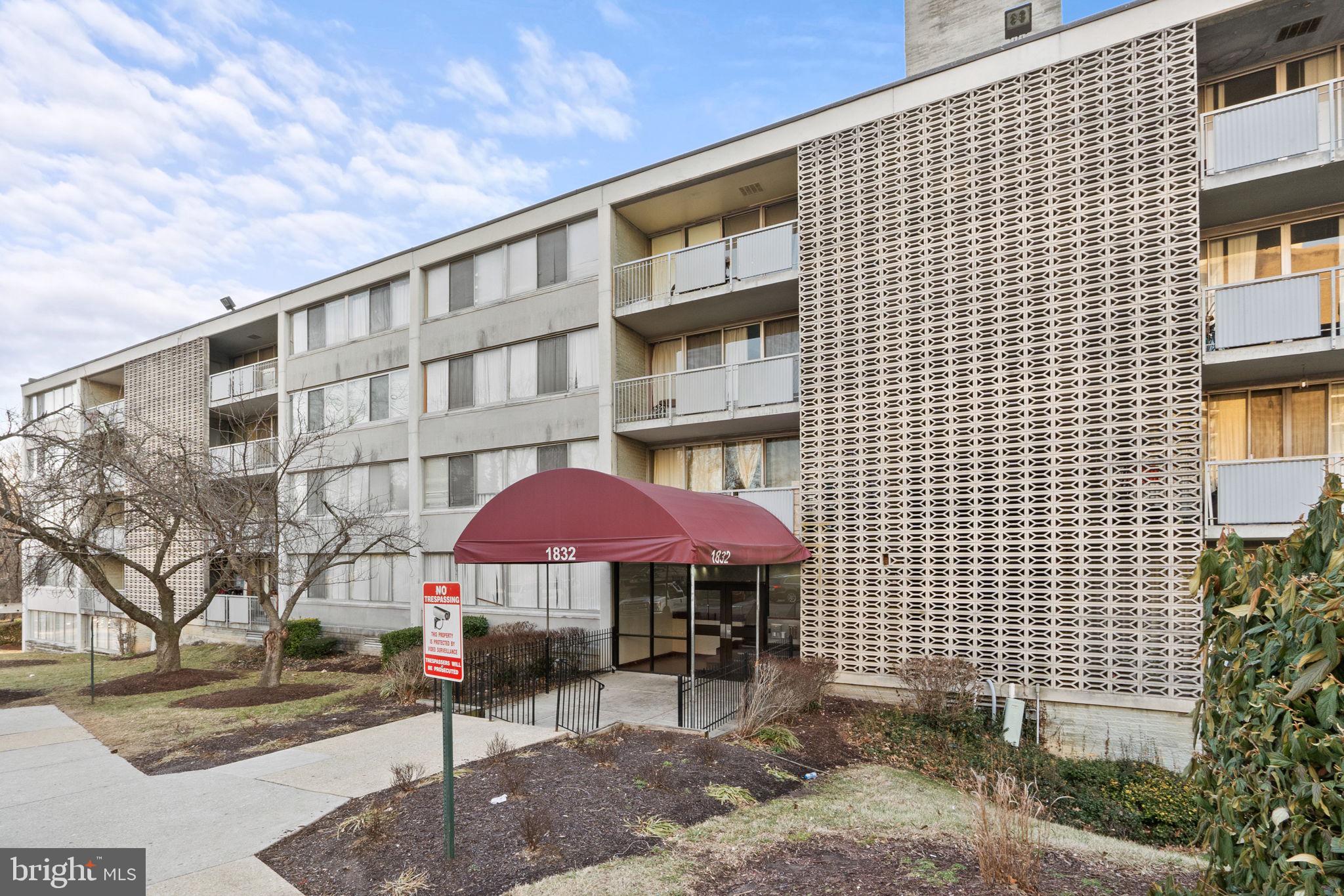 1832 Metzerott Road, Unit 303 Adelphi, MD 20783 - Photo 2 of 22 a front view of a building with garden