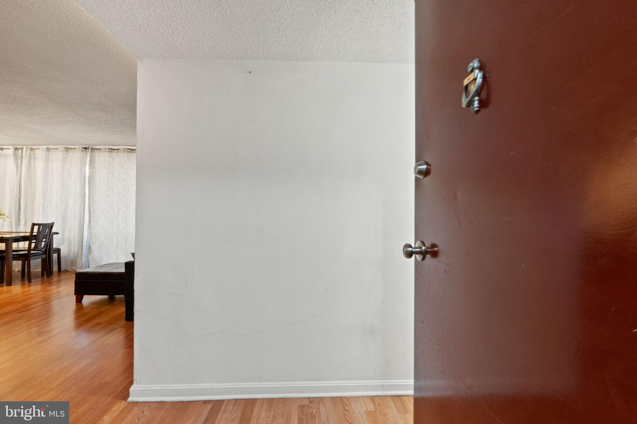 1832 Metzerott Road, Unit 303 Adelphi, MD 20783 - Photo 4 of 22 a view of a livingroom with wooden floor