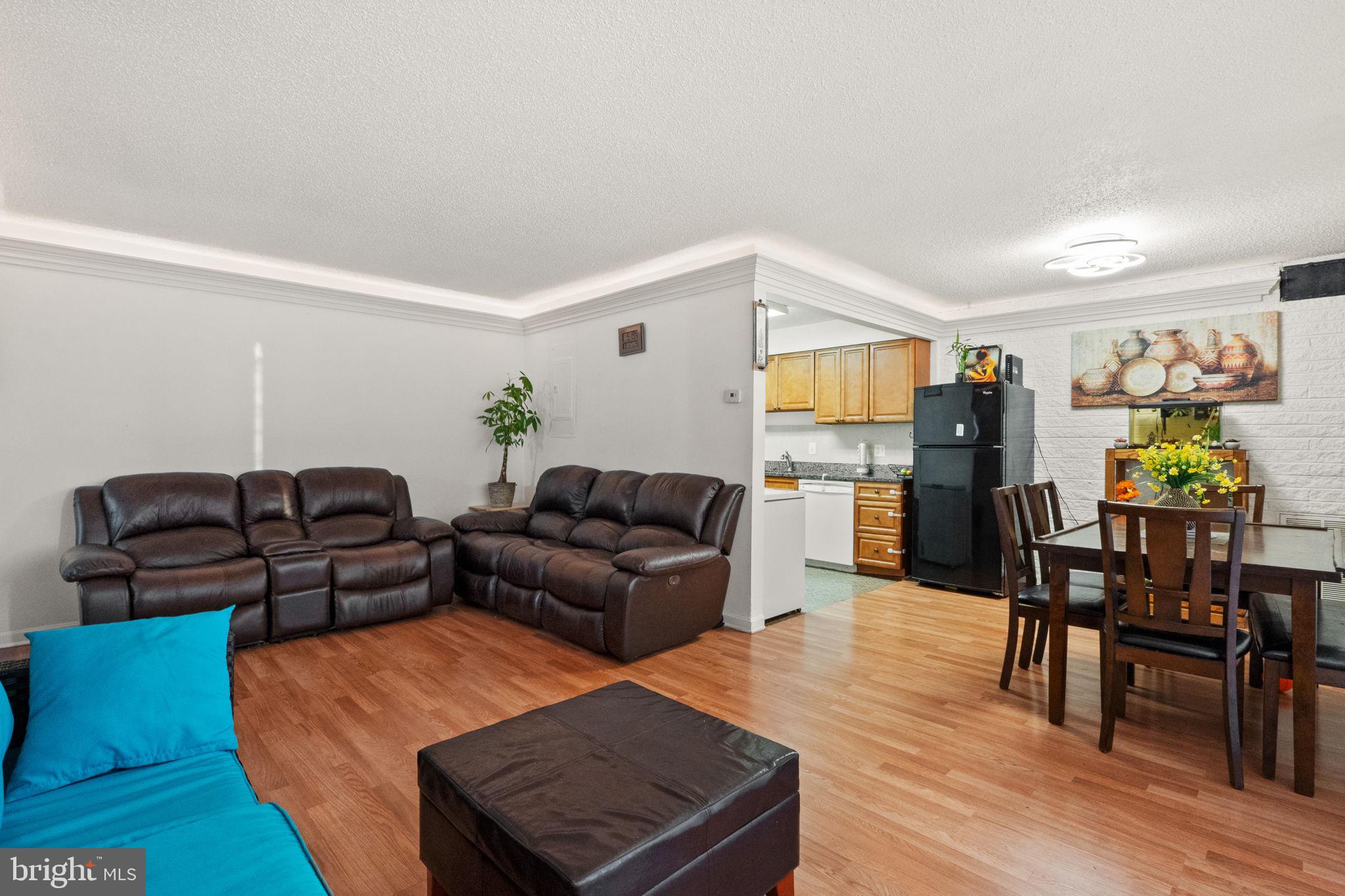 1832 Metzerott Road, Unit 303 Adelphi, MD 20783 - Photo 8 of 22 a living room with furniture and wooden floor