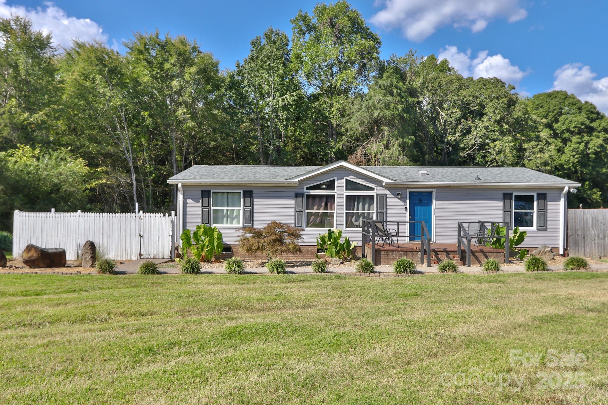 a front view of house with yard and seating area