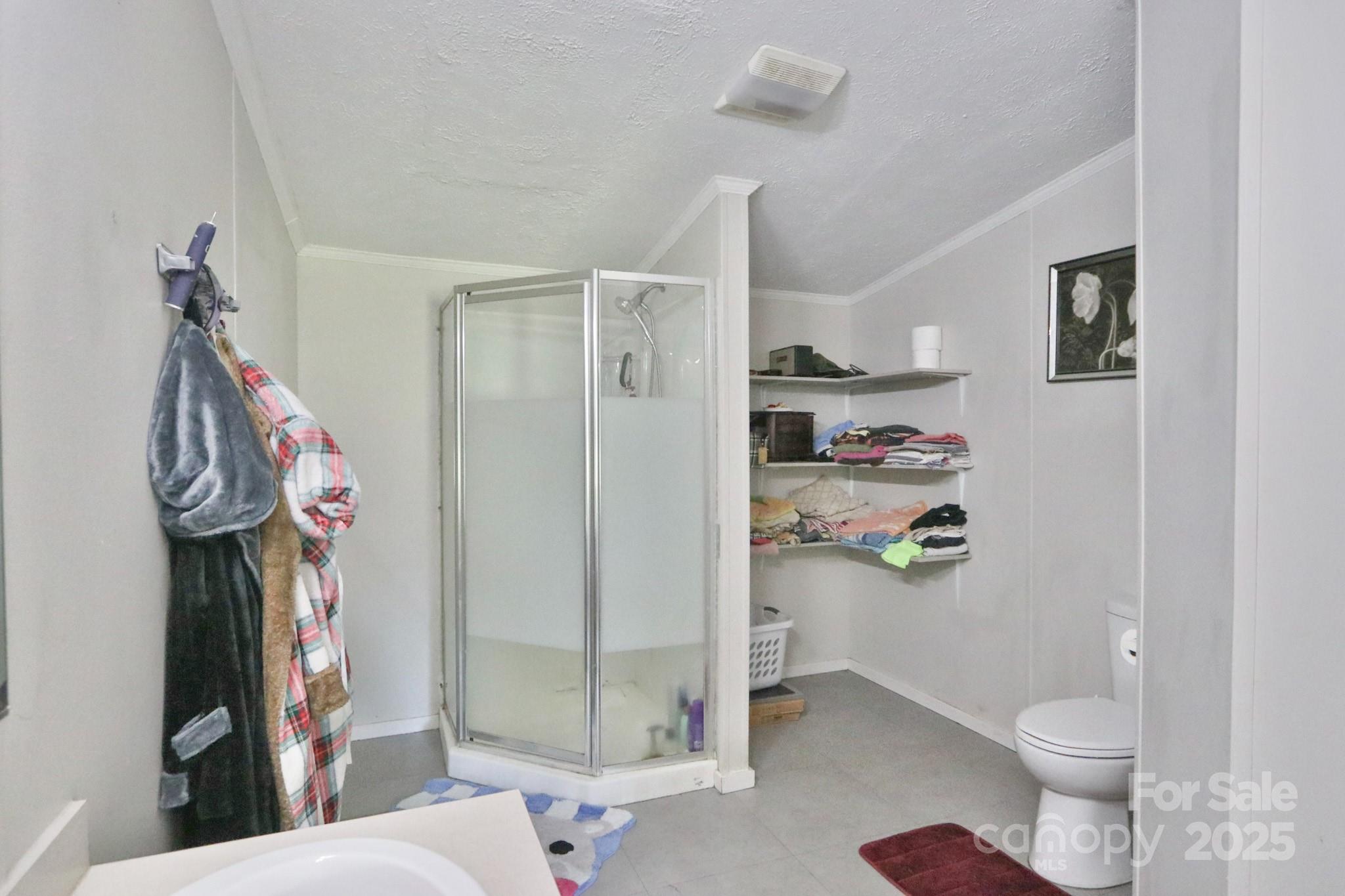 112 Courtney Road Mocksville, NC 27028 - Photo 13 of 31 a bathroom with a toilet sink and shower